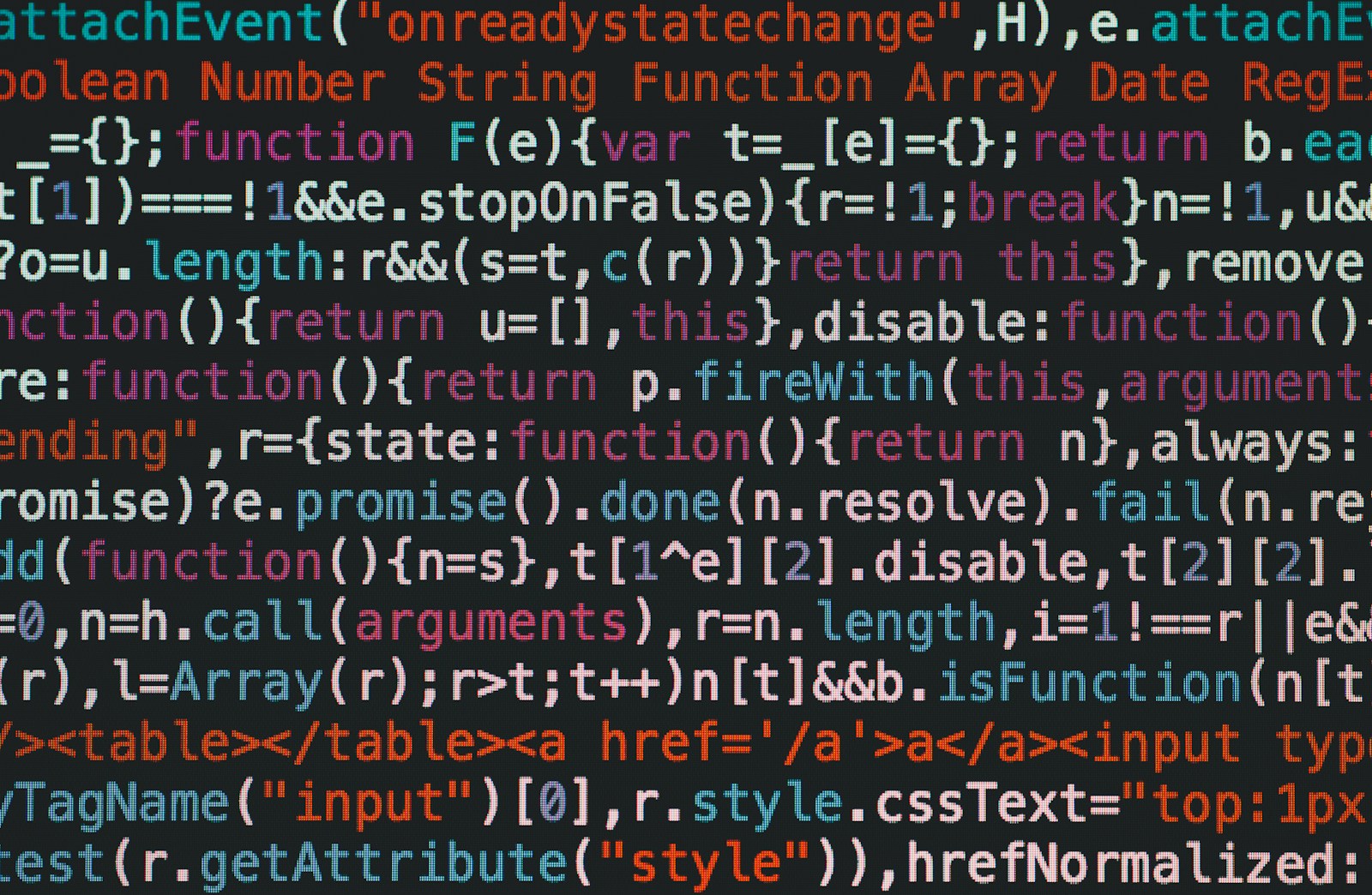 Close-up of colourful minified JavaScript code filling a dark screen, the kind of text a chatbot may read from a web page